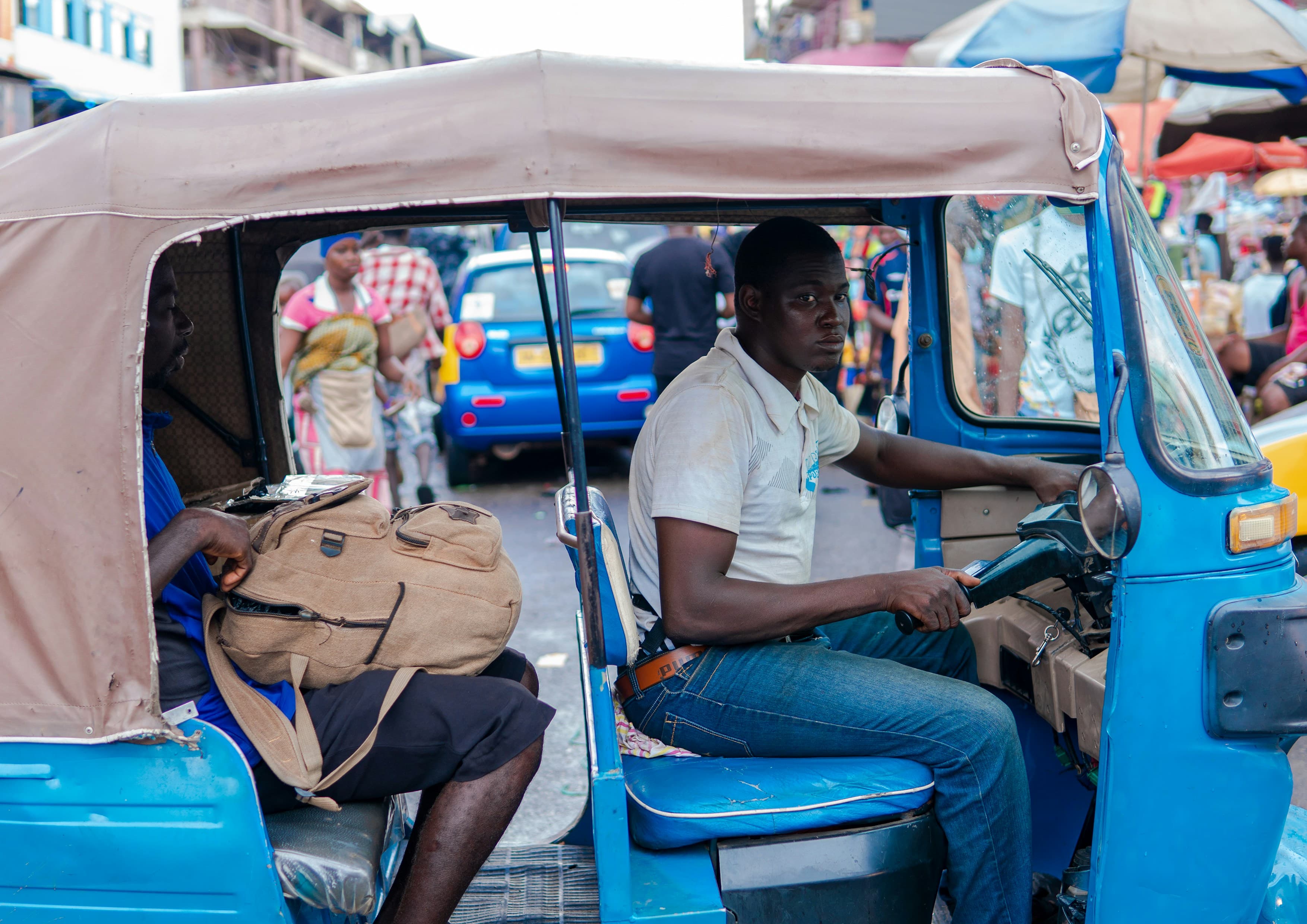 A tricycle taxi driver in Ghana